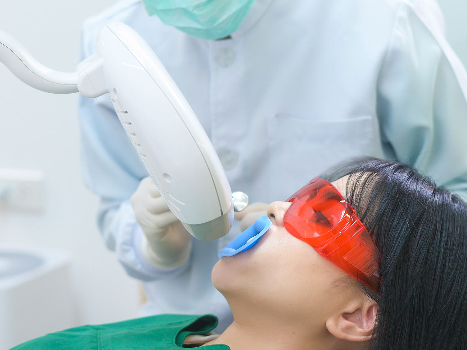 A child in the dentist's chair getting an X-ray.