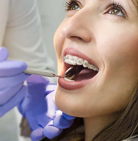 Woman with braces during a dental check-up.