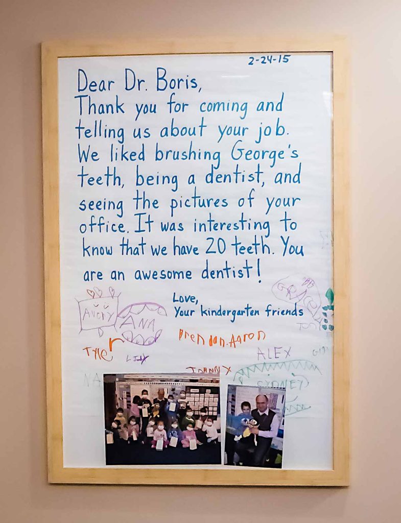 Framed thank-you letter with drawings and photos from kindergarten students to Dr. Boris.